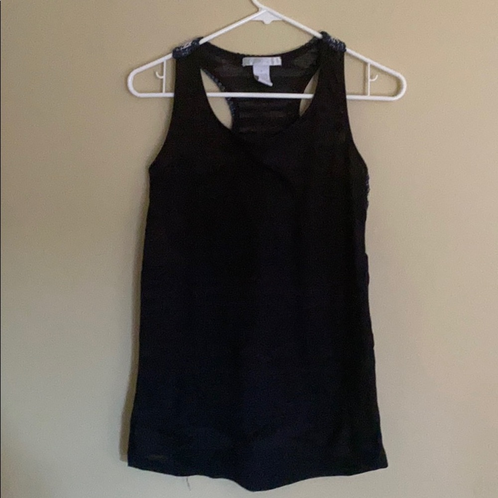 Adorable top with colorful stitching on back